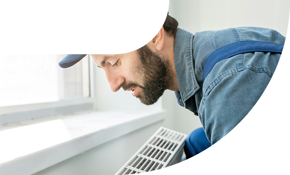 Man checking a radiator